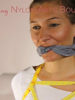 16 of Sexy Sandra being tied and gagged with ropes and