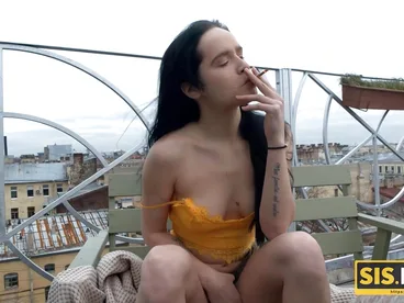 Leyla, a brunette sister, enjoys smoking and having sex with her stepbrother outdoors.