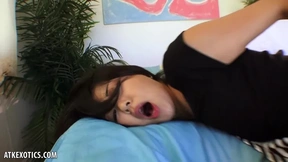 Saya Song, a tantalizing Asian beauty, pleasures herself by stimulating her petite breasts, tattooed body, and tight orifices to climax